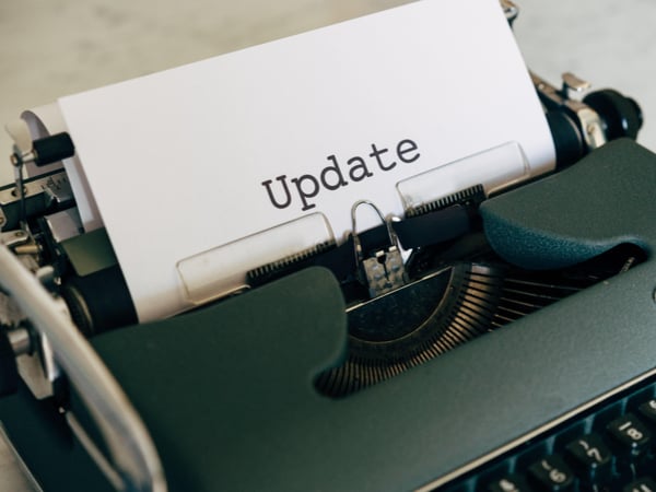 Typewriter with paper that says: "update"