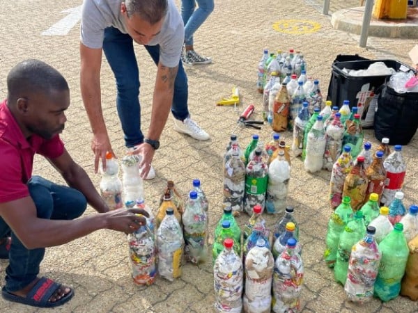 People moving plastic bottles